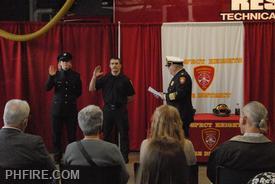 Chief Smith (R) administering the oath to Kieres (L) and Borkowski