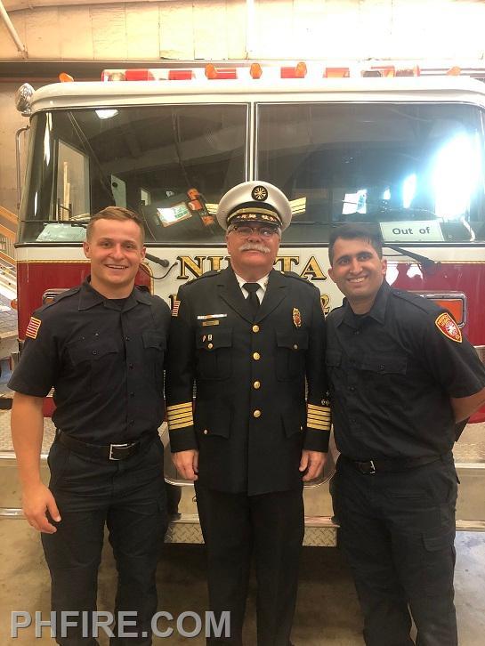 Chief Smith (center) with new firefighters  Marcin Kieta (left) and Americo Bernabei (right)