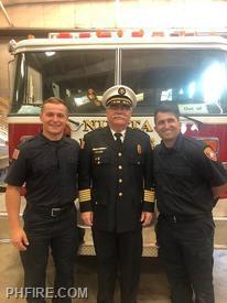 Chief Smith (center) with new firefighters  Marcin Kieta (left) and Americo Bernabei (right)